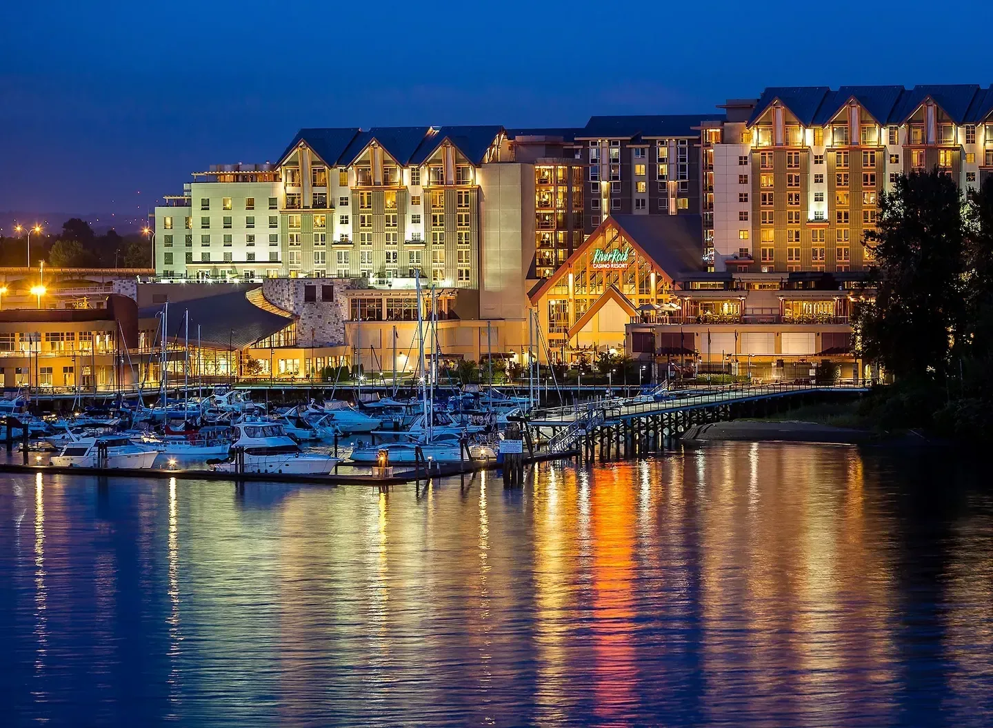 Riverfront resort architecture under evening light in Richmond, British Columbia